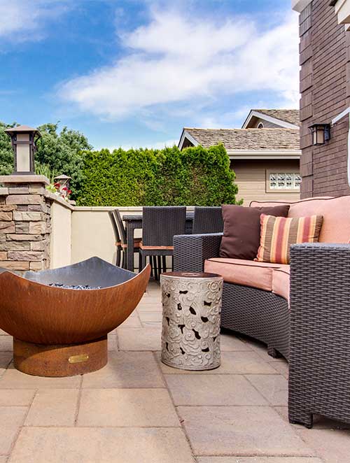 outdoor lounge space with a firepit and outdoor furniture