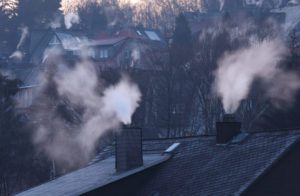 smoking chimneys on cold day